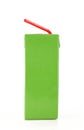 Green carton box with red plastic straw. Rectangular paper juice pack