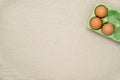 Green carton of different eggs. Easter background