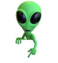 Green Cartoon Alien Pointing Down at Sign Royalty Free Stock Photo