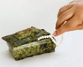 Green Casket hand taking pearl necklace from it Royalty Free Stock Photo