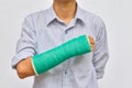 Green cast on hand and arm