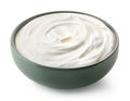 Green ceramic bowl of fresh greek yogurt or sour cream