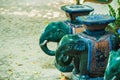 Green ceramic elephant in the garden Royalty Free Stock Photo