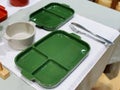 Green ceramic plates on a table in a restaurant. Selective focus. Royalty Free Stock Photo