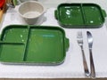 Green ceramic plates on a table in a restaurant. Selective focus. Royalty Free Stock Photo