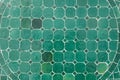 Green ceramic tile floor with geometric octagonal and square pattern Royalty Free Stock Photo