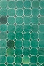 Green ceramic tile floor with geometric octagonal and square pattern Royalty Free Stock Photo