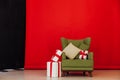 Green vintage chair in the interior of the red black room Royalty Free Stock Photo