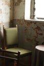 green chair put on the grunge corner Royalty Free Stock Photo