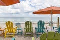 Green chairs and blue summer beach house. Royalty Free Stock Photo