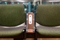 Green chairs with free standard USB power socket or USB port slot charger in airport. Travelling comfort