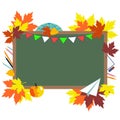 Green chalkboard, school supplies and autumn leaves.