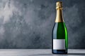 A bottle of champagne with a blank label on a table Royalty Free Stock Photo