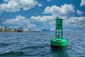 Green Channel Marker and Cruise Ship in Background Royalty Free Stock Photo