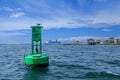 Green channel marker and cruise ship Royalty Free Stock Photo