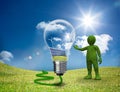 Green character showing a light bulb Royalty Free Stock Photo