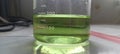 green chemical on glass container& x29;