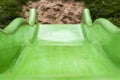 Green child slide on playground Royalty Free Stock Photo