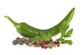 Green chili pepper, parsley and mixed peppercorn on white background Royalty Free Stock Photo