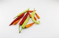 Green chili, red chili Yellow peppers placed on a white background Royalty Free Stock Photo