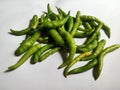 Green chillies isolated & exposed to sunlight Royalty Free Stock Photo