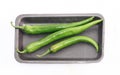 Green chilly peppers on tray Royalty Free Stock Photo