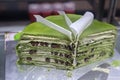 Green chinese cake with chocolate grains and green tea