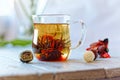 Green chinese tea flower bud blooming in glass tea cup. Morning breakfast. shallow depth of field Royalty Free Stock Photo