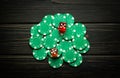 Green chips on a vintage dark table from a successful combination in a game of dice or craps. Low key concept of a gambling and Royalty Free Stock Photo