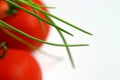 Green chives over tomatoes