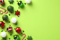 Green Christmas background with festive ornaments. Flat lay, top view, copy space Royalty Free Stock Photo