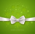 Green Christmas background ribbon with white silk
