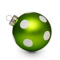 Green christmas ball with spots on white background