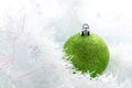 Green christmas ball on white brunch background. Royalty Free Stock Photo