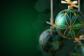 Green christmas balls hanging on abstract background Royalty Free Stock Photo