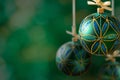 Green christmas balls hanging on abstract background Royalty Free Stock Photo