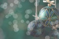 Green christmas balls hanging on abstract background Royalty Free Stock Photo