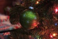 Green Christmas Bulb closeup on a Christmas Tree Royalty Free Stock Photo