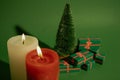 Green Christmas tree gifts. Winter holidays Happy New Year 2023. Burning candles Royalty Free Stock Photo