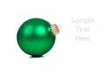 A green Christmas ornament/bauble on white Royalty Free Stock Photo