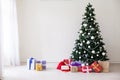 Green Christmas tree with gifts of toys for the new year holiday decor winter Royalty Free Stock Photo