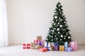 Green Christmas tree with gifts of toys for the new year holiday decor winter Royalty Free Stock Photo