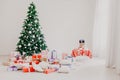 Green Christmas tree with gifts of toys for the new year holiday decor winter Royalty Free Stock Photo