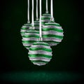 Christmas tree ornaments hanging. Balls made of glass or plastic hanging over abstract background Royalty Free Stock Photo