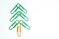 Green christmas tree from paperclip on white background isolated Royalty Free Stock Photo