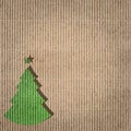 Green christmas tree on recycling paper. Environment concept