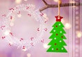 Green Christmas tree with red star ornament hanging on branch hand drawn doodle wreath with winterberries on pastel background Royalty Free Stock Photo