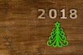 Green Christmas tree and sign 2018 from wooden letters