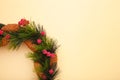 Green christmas wreath decorated with red viburnum on biege background. Thanksgiving Day