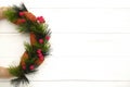 Green christmas wreath decorated on white wooden background. Thanksgiving Day Royalty Free Stock Photo